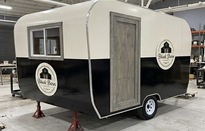 Black Barn Bakery trailer — door and window side in shop