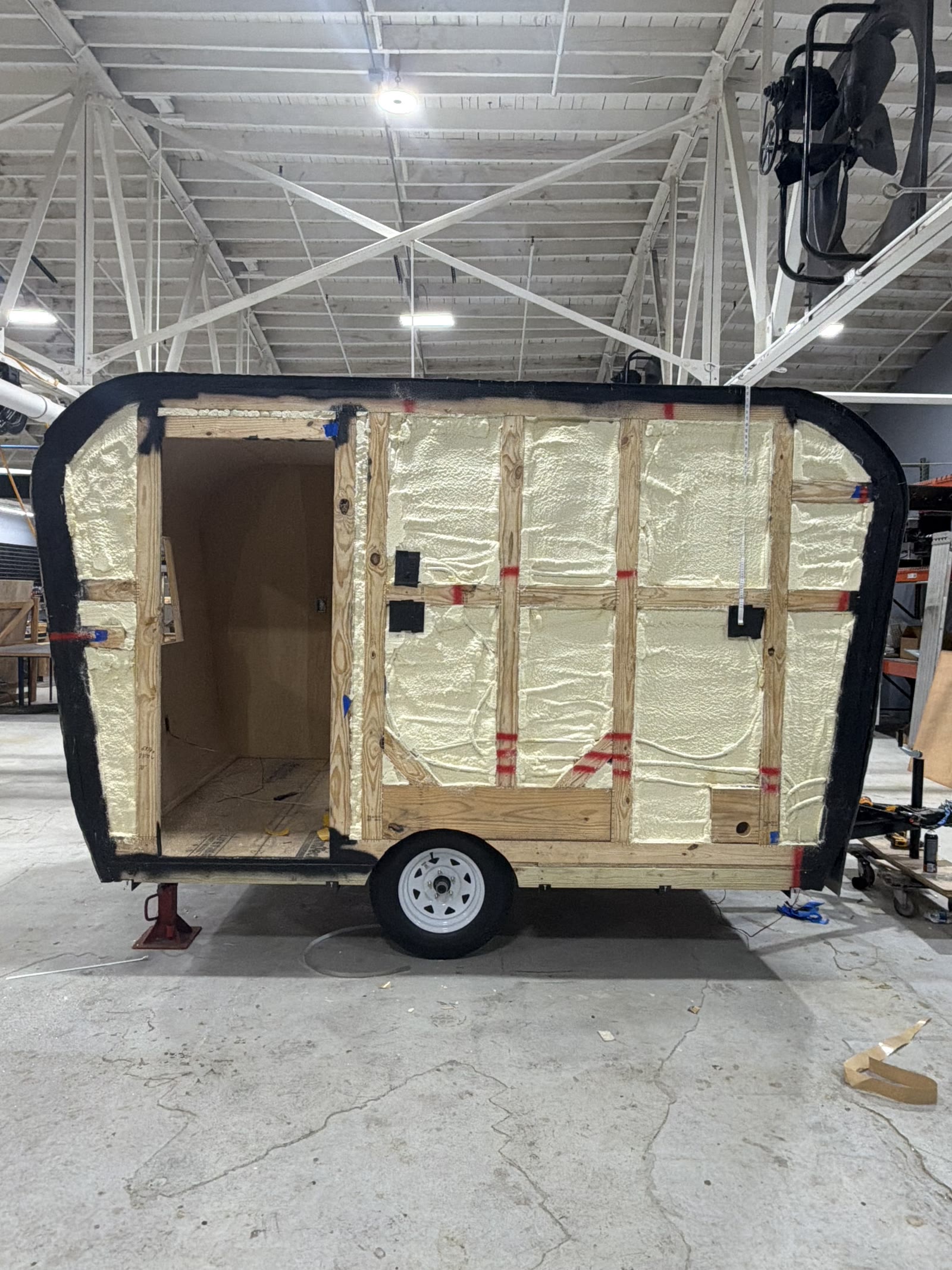 Closed-cell spray foam insulation in trailer wall cavities