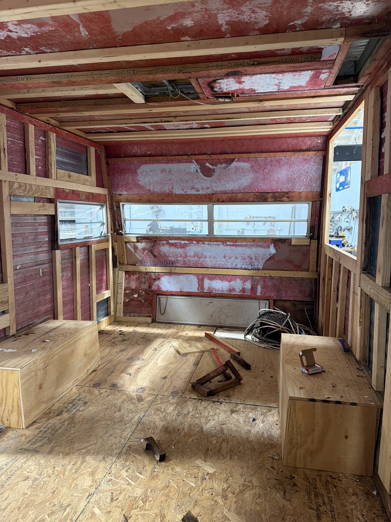 Renovated trailer interior framing toward rear