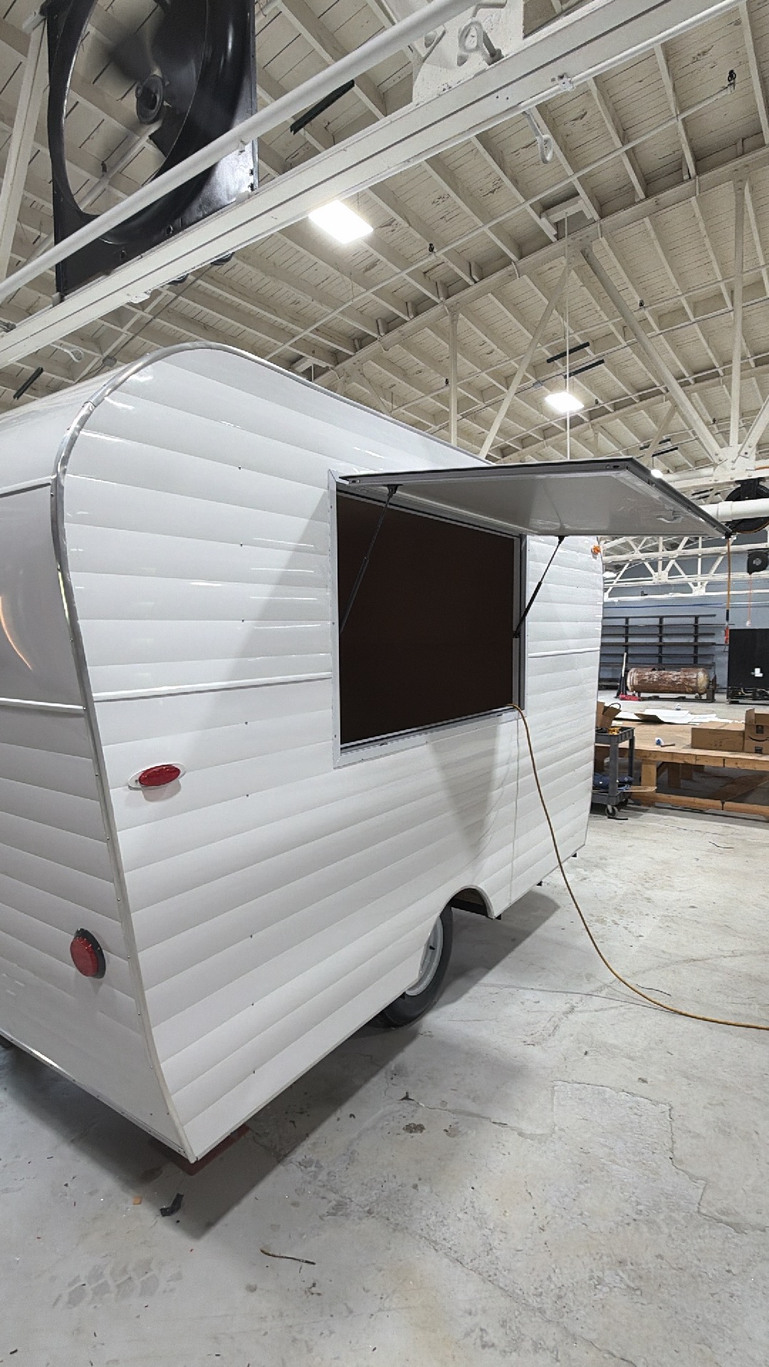 Clean white retro trailer with service window open