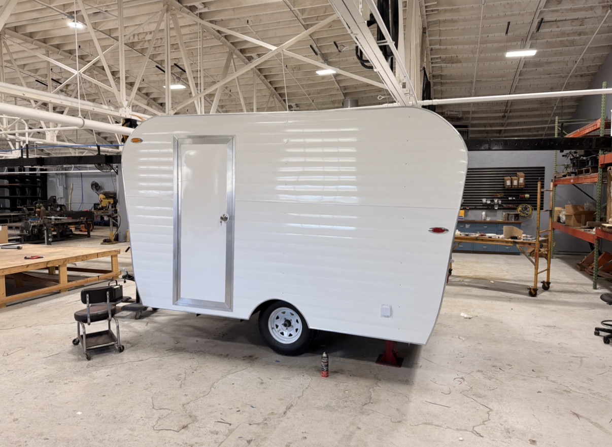Clean white retro trailer side view