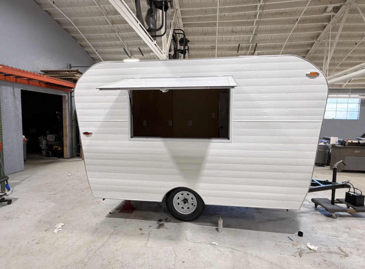 Clean white retro trailer side profile with hitch